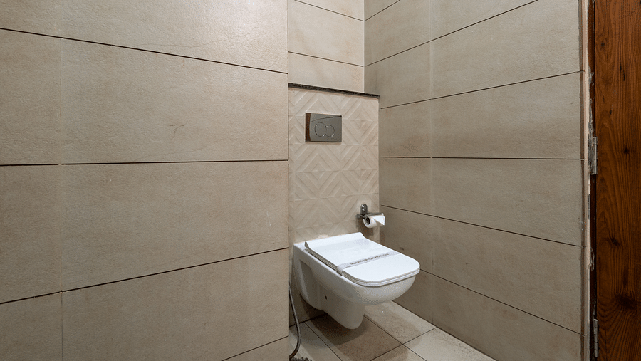 Modern bathroom featuring a Western-style toilet and sleek design at DLS The Classio